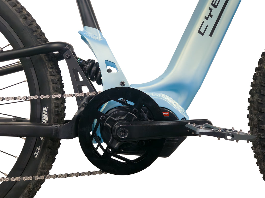 Close-up of the front view of the mid-drive motor on the Cyberbike Fusion electric mountain bike, showcasing its powerful and compact design.